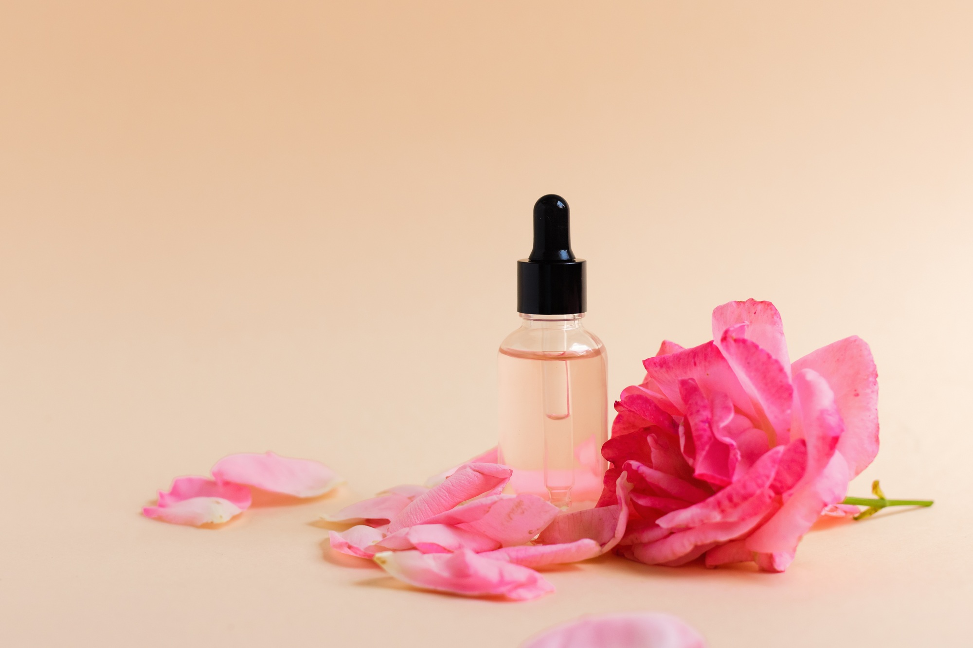 A bottle with collagen or hyaluronic acid on a neutral background